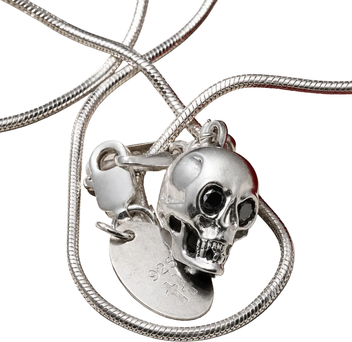 Sterling silver skull pendant with black diamond eyes